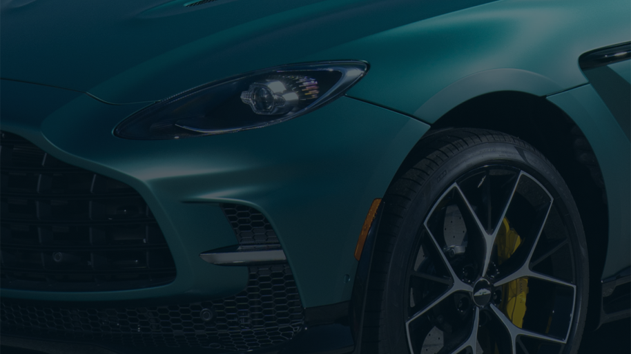 Close up view of Aston Martin DBX707 grill, wheel, and headlight